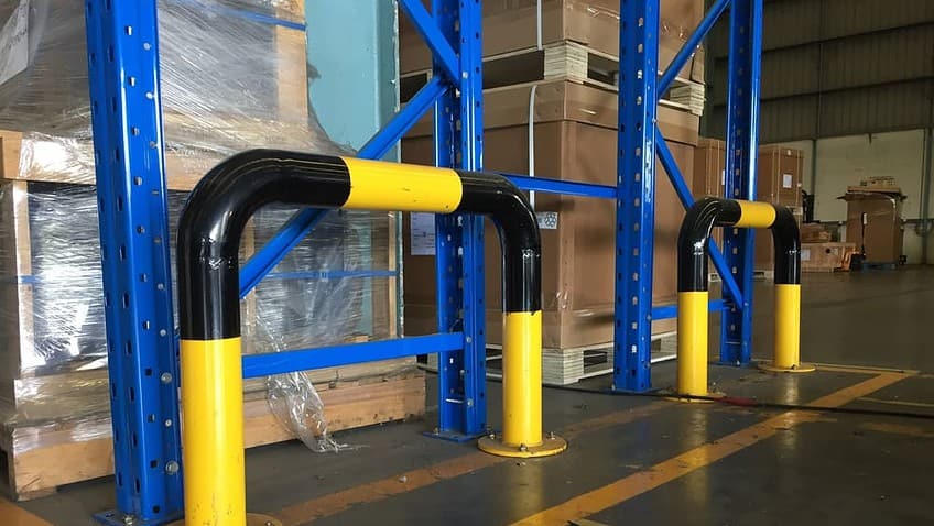 Pipe frame barriers protect racks and valuable merchandise.