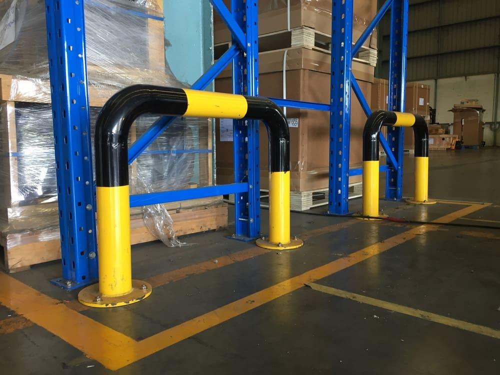 Pipe frame barriers protect racks and valuable merchandise.
